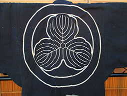 Mon view - Heavy dark indigo festival kimono; large paste resist dyed (tsutsugaki) hawk, pine, large three leaf mon, antique mingei fabrics